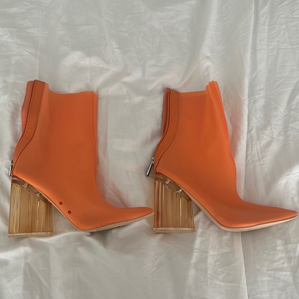 Orange high heeled boots